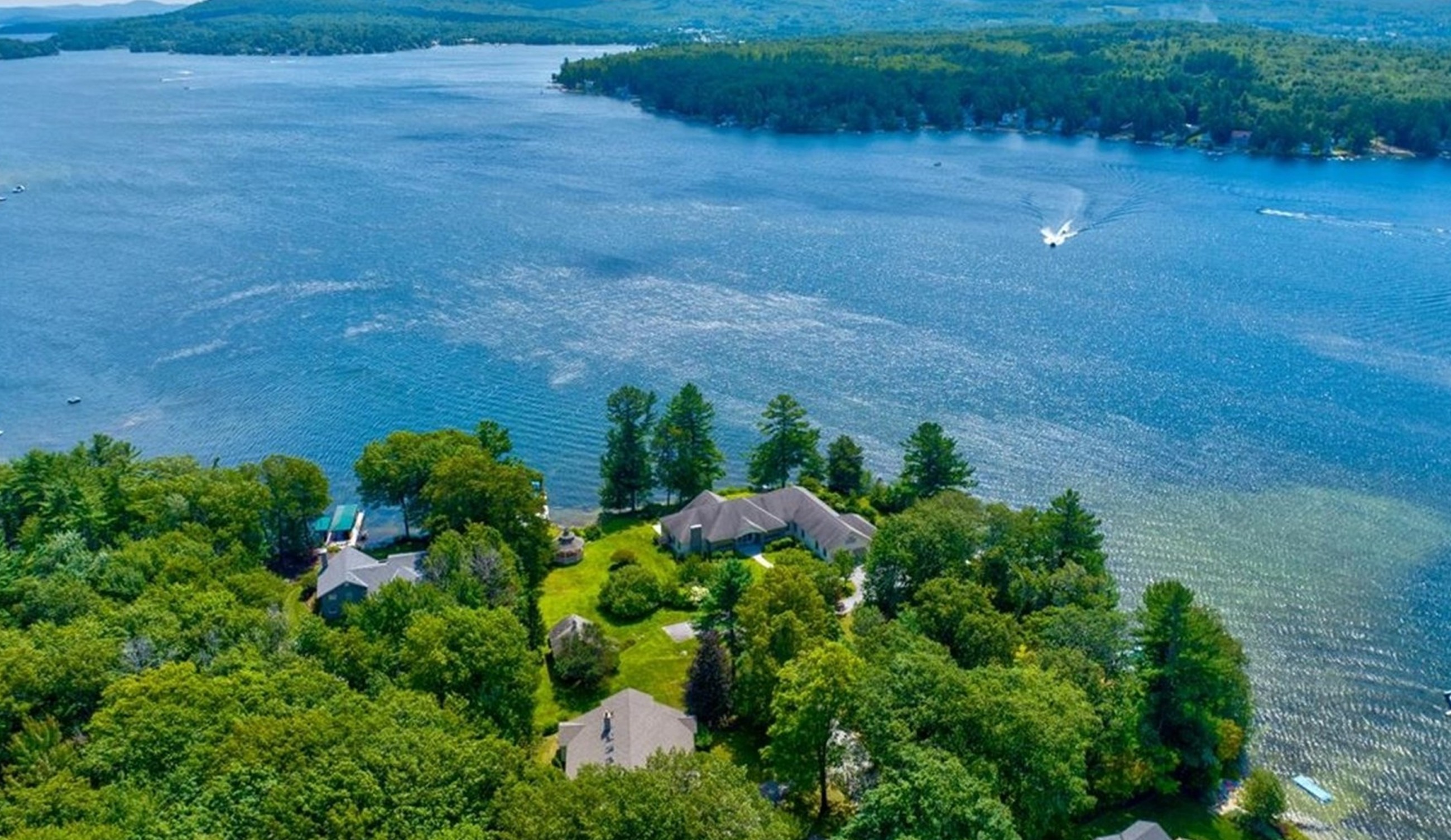 Boat driving to a house on the water