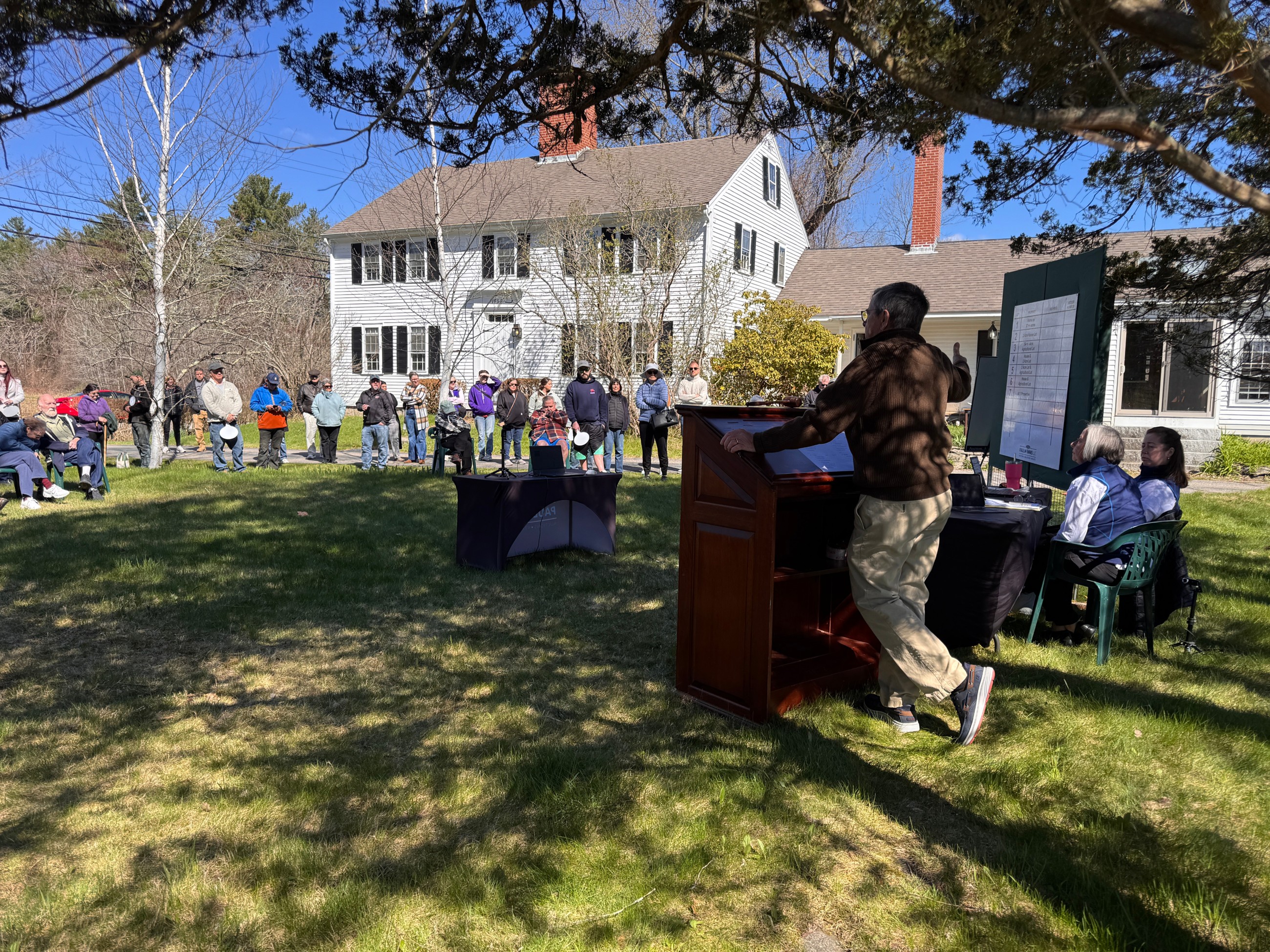 An auction happening outside an estate